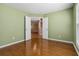 Bright bedroom with hardwood floors and double doors at 480 Glenns Farm Way, Grayson, GA 30017