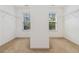 Walk-in closet featuring carpet, two windows, and wire shelving at 480 Glenns Farm Way, Grayson, GA 30017