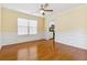 Dining room featuring hardwood floors, wainscoting, and ceiling fan at 480 Glenns Farm Way, Grayson, GA 30017