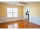 Bright dining room with yellow walls, wainscoting, hardwood flooring, and a modern ceiling fan at 480 Glenns Farm Way, Grayson, GA 30017