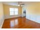 Inviting dining room with wainscoting, hardwood floors, and a view into the kitchen at 480 Glenns Farm Way, Grayson, GA 30017