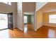 Open entryway featuring hardwood floors, high ceilings, and views into adjoining rooms with light walls at 480 Glenns Farm Way, Grayson, GA 30017
