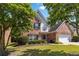 Charming two-story brick home with well-manicured lawn and attached two-car garage at 480 Glenns Farm Way, Grayson, GA 30017