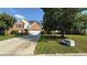 Lovely home boasts brick and siding, attached two-car garage, large driveway, and expansive front yard at 480 Glenns Farm Way, Grayson, GA 30017