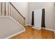 Bright foyer featuring hardwood floors, a staircase, and a glimpse of the front door at 480 Glenns Farm Way, Grayson, GA 30017
