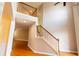 Bright foyer featuring hardwood floors, a staircase, and a high ceiling, creating a welcoming entrance at 480 Glenns Farm Way, Grayson, GA 30017