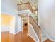 Inviting foyer with hardwood floors, staircase, and an open view to the living room with fireplace at 480 Glenns Farm Way, Grayson, GA 30017