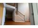 Spacious entry foyer with hardwood floors, staircase with wooden banister, and access to adjacent rooms at 480 Glenns Farm Way, Grayson, GA 30017
