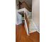 Bright entry foyer boasts hardwood floors, a staircase with wooden railings, and an airy ambiance at 480 Glenns Farm Way, Grayson, GA 30017