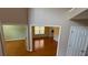 Upstairs hallway providing views of multiple rooms with hardwood floors and ample sunlight at 480 Glenns Farm Way, Grayson, GA 30017