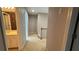Upstairs hallway featuring carpet flooring, neutral paint, and access to a bathroom at 480 Glenns Farm Way, Grayson, GA 30017
