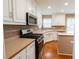 Kitchen features stainless steel oven, a microwave, and plenty of counter space at 480 Glenns Farm Way, Grayson, GA 30017