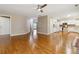 Open concept living area with hardwood floors connecting to the kitchen at 480 Glenns Farm Way, Grayson, GA 30017