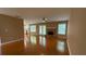 Inviting living area with hardwood floors, a brick fireplace, and access to the outdoors through French doors at 480 Glenns Farm Way, Grayson, GA 30017