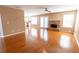 Spacious living room featuring hardwood floors, a brick fireplace, and French doors leading outside at 480 Glenns Farm Way, Grayson, GA 30017