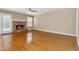 Living room features a brick fireplace, hardwood floors and natural light at 480 Glenns Farm Way, Grayson, GA 30017