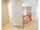 Staircase leading to the second floor features a wooden railing and neutral carpet at 480 Glenns Farm Way, Grayson, GA 30017