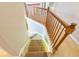 Staircase with carpet steps and wooden railing at 480 Glenns Farm Way, Grayson, GA 30017