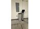 Utility room with water softener and electrical panel against white wall at 480 Glenns Farm Way, Grayson, GA 30017