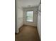 A walk-in closet with carpeted floors, a window, and wire shelving at 480 Glenns Farm Way, Grayson, GA 30017