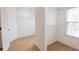 Walk-in closet featuring two separate spaces with shelves and carpet at 480 Glenns Farm Way, Grayson, GA 30017