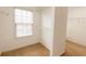 Bright walk-in closet with carpet, shelving, and a window at 480 Glenns Farm Way, Grayson, GA 30017