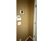 Close up of a wall-mounted thermostat and a dated security system panel at 480 Glenns Farm Way, Grayson, GA 30017