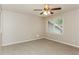 This cozy bedroom features neutral walls, comfortable carpet, and a ceiling fan for added comfort at 4893 Autumn Cir, Stone Mountain, GA 30088