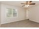 Bright bedroom featuring a window, neutral walls, and carpet flooring at 4893 Autumn Cir, Stone Mountain, GA 30088