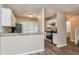 Well-lit kitchen featuring stainless steel appliances, white cabinets, and stone countertops at 4893 Autumn Cir, Stone Mountain, GA 30088