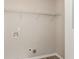 This laundry room has shelving and washer/dryer hookups at 4893 Autumn Cir, Stone Mountain, GA 30088