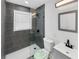 Contemporary bathroom features a tiled shower, white vanity, and modern fixtures at 136 Victor Nw Cir, Atlanta, GA 30314