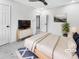 Cozy bedroom with neutral tones, a ceiling fan, a modern dresser, and a comfortable bed at 136 Victor Nw Cir, Atlanta, GA 30314