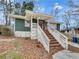 Charming home with a welcoming front porch, complemented by a well-maintained yard and inviting curb appeal at 136 Victor Nw Cir, Atlanta, GA 30314