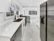 Modern kitchen with stainless steel appliances, light countertops, and view of the bright living room at 136 Victor Nw Cir, Atlanta, GA 30314