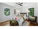 Cozy bedroom with bright natural light, a ceiling fan and comfortable furnishings at 1943 Main Nw St, Atlanta, GA 30318