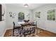 Cozy dining room with a modern table, hardwood floors, and bright natural light at 1943 Main Nw St, Atlanta, GA 30318