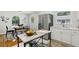 Charming kitchen features stainless steel appliances, white cabinets, marble counters and an island at 1943 Main Nw St, Atlanta, GA 30318