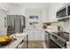 Beautiful kitchen featuring white cabinets, stainless steel appliances, and ample countertop space at 1943 Main Nw St, Atlanta, GA 30318