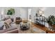Elegant living room with modern furniture, hardwood floors, and ample natural light at 1943 Main Nw St, Atlanta, GA 30318