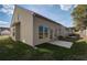Exterior view of backyard with grassy area, fenced-in perimeter, and exterior walls at 2208 Croghan Dr, Hampton, GA 30228