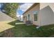 Backyard of home featuring a grassy area, fenced perimeter, and exterior walls at 2208 Croghan Dr, Hampton, GA 30228