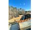 Large backyard featuring a playset and volleyball court, ideal for outdoor activities at 3499 Lake Mill Rd, Buford, GA 30519