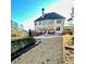 Backyard view featuring a patio, fire pit and multi-story home with big windows at 3499 Lake Mill Rd, Buford, GA 30519