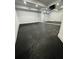 This basement boasts a mirrored wall and painted floor, perfect for a home gym or recreation room at 3499 Lake Mill Rd, Buford, GA 30519