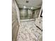 Spacious bathroom with a large glass shower, sleek vanity, and modern marble floors at 3499 Lake Mill Rd, Buford, GA 30519