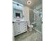Bright bathroom with a glass enclosed shower and modern vanity at 3499 Lake Mill Rd, Buford, GA 30519