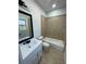 Bathroom with tiled shower, and sink with tiled floors and walls at 3499 Lake Mill Rd, Buford, GA 30519