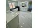 Spacious bathroom with double vanity, soaking tub, and marble floors at 3499 Lake Mill Rd, Buford, GA 30519