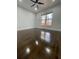 Cozy bedroom with hardwood floors and a large window with wooded views at 3499 Lake Mill Rd, Buford, GA 30519